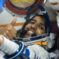 spaceflight-participant-hazzaa-ali-almansoori-flashes-a-thumbs-up-as-he-runs-through-procedures-aboard-the-soyuz-ms-15-spacecraft_48719601116_o.jpg