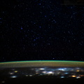 stars-glitter-in-the-night-sky-above-earths-atmospheric-glow_49307003306_o.jpg
