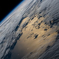 nasa2explore_50922552591_The_Earths_horizon_and_a_cloudy_Pacific_Ocean.jpg