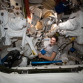 nasa2explore_51857539687_NASA_astronaut_Kayla_Barron_works_on_a_pair_of_U.S._spacesuits.jpg