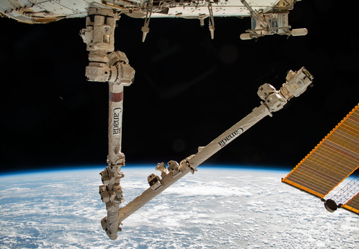 the-canadarm2-robotic-arm-extends-from-the-space-station 53269595862 o