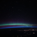 an-aurora-above-the-city-lights-and-a-beneath-a-starry-sky_49672289888_o.jpg